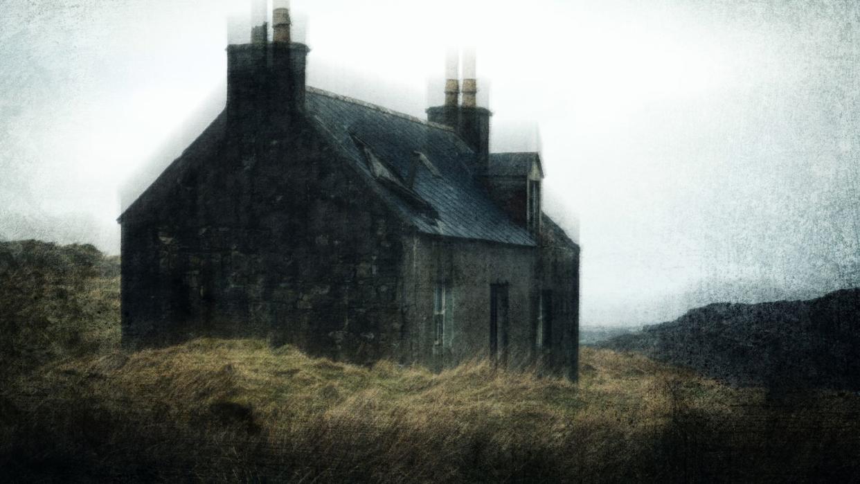 a spooky abandoned ruined cottage on a bleak empty moorland mountain in scotland on a winters day with a grunge, textured edit