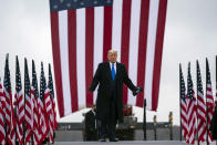 President Donald Trump arrives at Capital Region International Airport for a campaign rally, Tuesday, Oct. 27, 2020, in Lansing, Mich. (AP Photo/Evan Vucci)