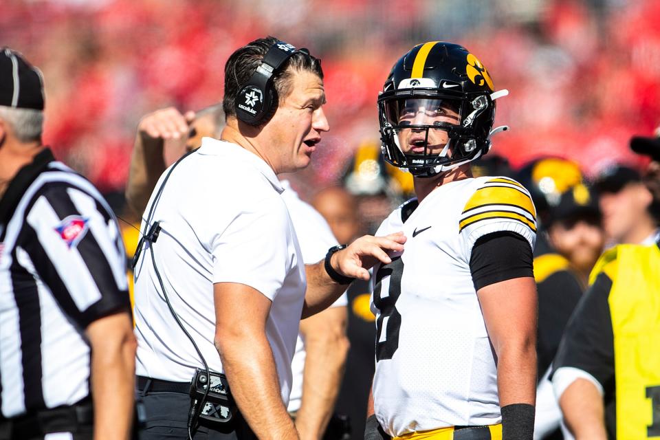 Iowa offensive coordinator and quarterbacks coach Brian Ferentz talks with QB Alex Padilla during the game against Ohio State.