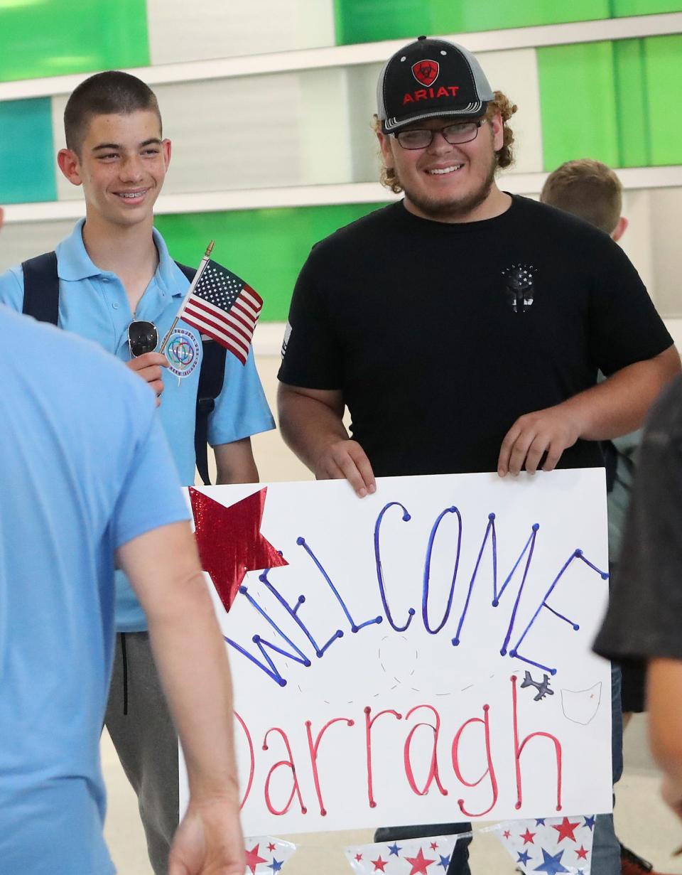 American host teen Axtin Collins, 15, right, poses with Ulster Project teen Darragh Quaid, 15, left, on Monday, June 26, 2023, in the arrival area of Akron-Canton Airport.