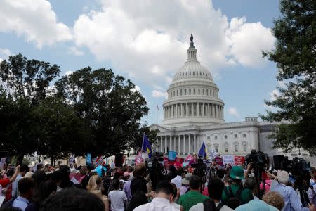 Protestors gather during a demonstration against the Republican repeal of the Affordable Care Act, outside the U.S. Capitol in Washington, U.S., June 21, 2017. REUTERS/Aaron P. Bernstein