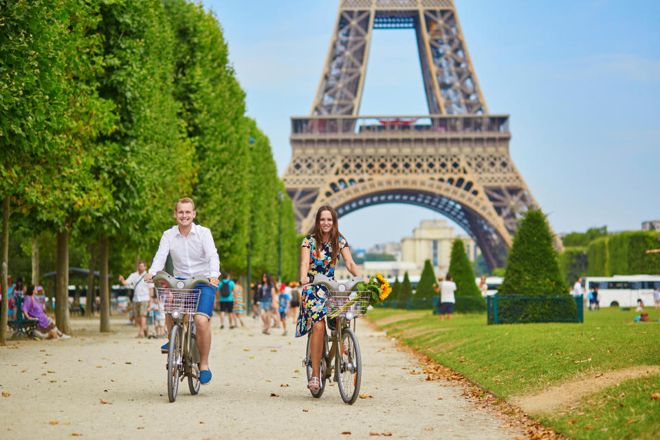 Tourists riding bikes near the Eiffel Tower