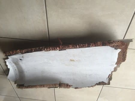 A piece of debris found by a South African family off the Mozambique coast in December 2015, which authorities will examine to see if it is from missing Malaysia Airlines flight MH370, is pictured in this handout photo released to Reuters March 11, 2016. REUTERS/Candace Lotter/Handout via Reuters