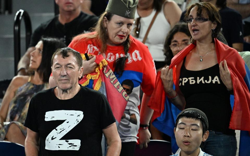 Pro-Russian protesters appear during Novak Djokovic's quarter-final against Russian Andrey Rublev - LUKAS COCH/EPA-EFE/Shutterstock