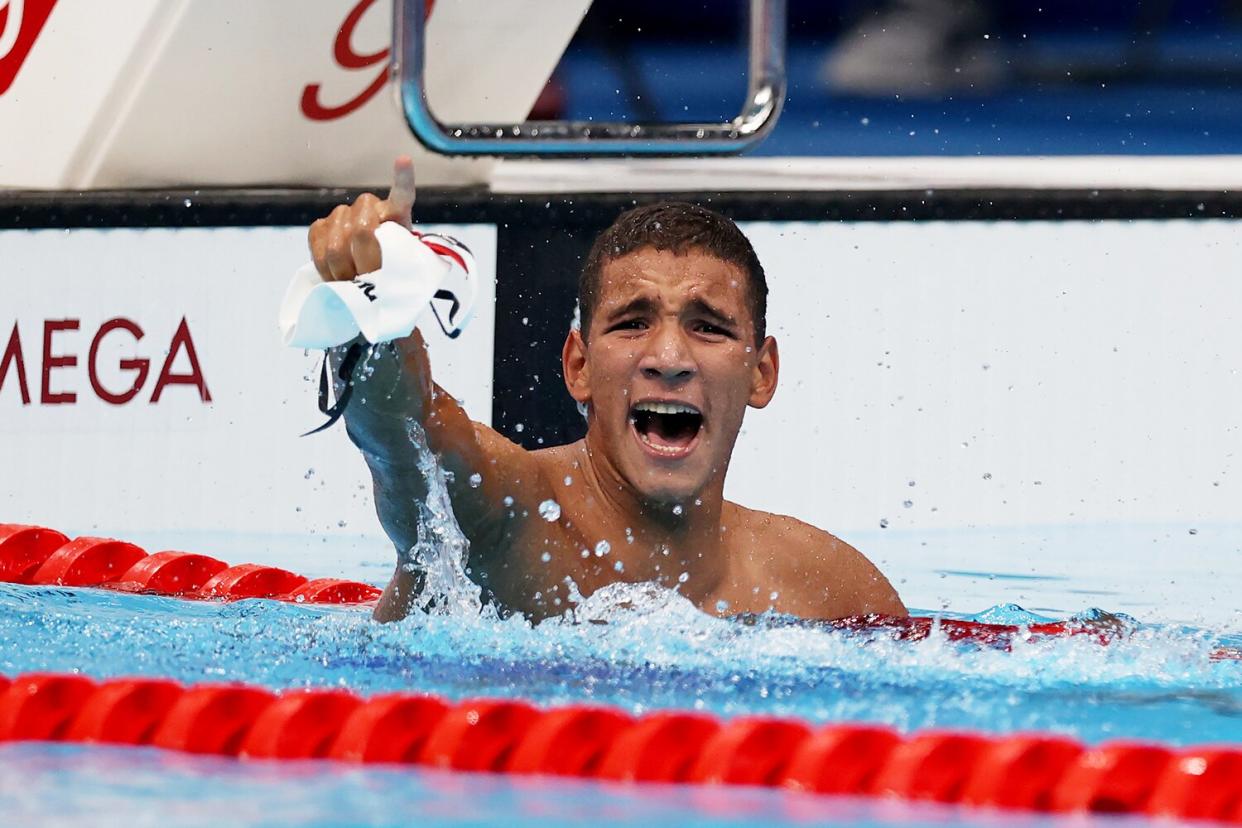 Ahmed Hafnaoui of Team Tunisia celebrates after winning the gold medal in the Men's 400m Freestyle Final on day two of the Tokyo 2020 Olympic Games at Tokyo Aquatics Centre on July 25, 2021 in Tokyo, Japan.