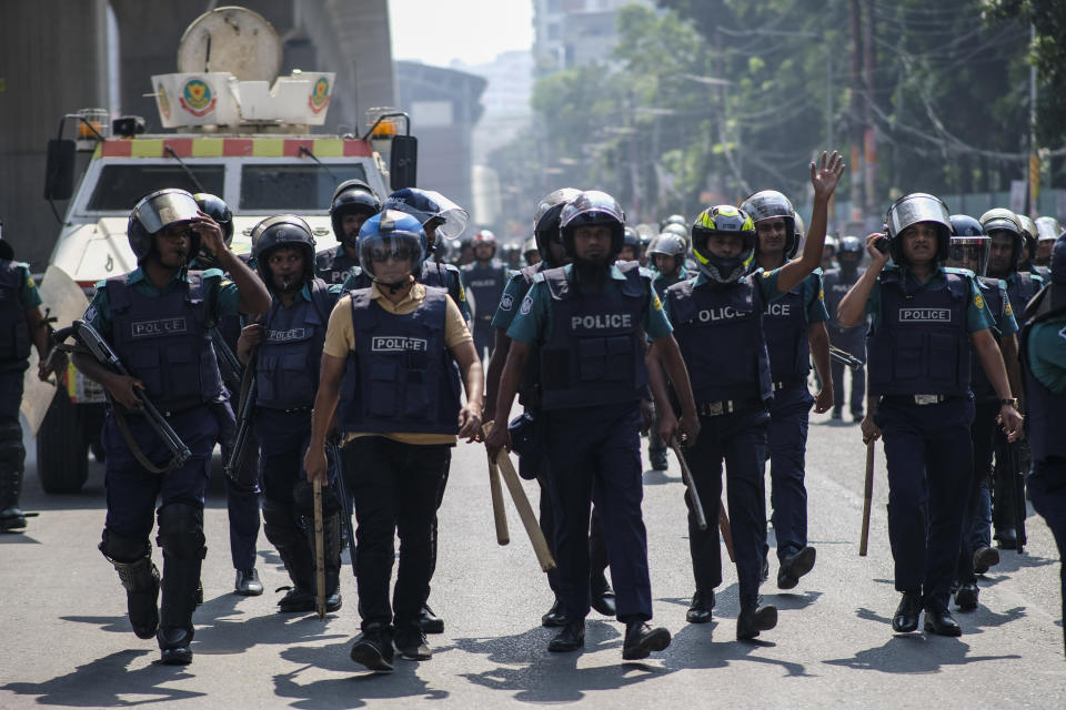 Police arrive to disperse Bangladeshi garment factory workers who were blocking traffic demanding better wages at Dhaka-Mirpur area in Bangladesh, Thursday, Nov.2, 2023. (AP Photo/Mahmud Hossain Opu)