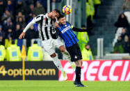 Soccer Football - Serie A - Juventus vs Inter Milan - Allianz Stadium, Turin, Italy - December 9, 2017 Inter Milan's Mauro Icardi in action with Juventus’ Medhi Benatia REUTERS/Massimo Pinca