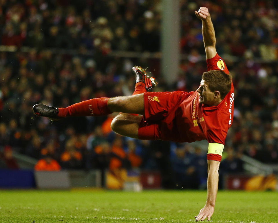 Liverpool's Steven Gerrard shoots at goal during their Europa League soccer match against Zenit St. Petersburg at Anfield in Liverpool, northern England, February 21, 2013. REUTERS/Darren Staples (BRITAIN - Tags: SPORT SOCCER) - RTR3E3HA