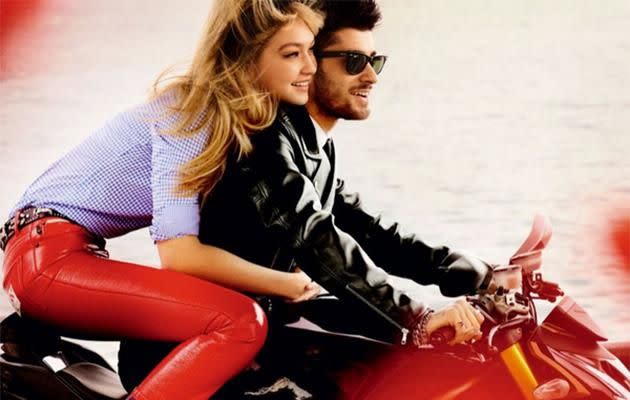 Hadid, wearing a Miu Miu shirt and Marc Jacobs pants, holds on tight to her beau Zayn, cruising on a motorcycle in a Gucci leather jacket and Ray-Ban sunglasses. (Photo: Mario Testino for Vogue)