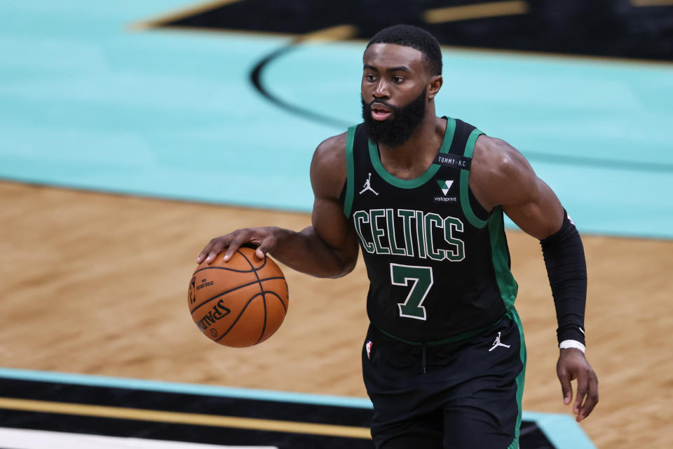 Boston Celtics guard Jaylen Brown (7) brings the ball up court against the Charlotte Hornets in the second half at Spectrum Center. The Charlotte Hornets won 125-104. Mandatory Credit: Nell Redmond-USA TODAY Sports