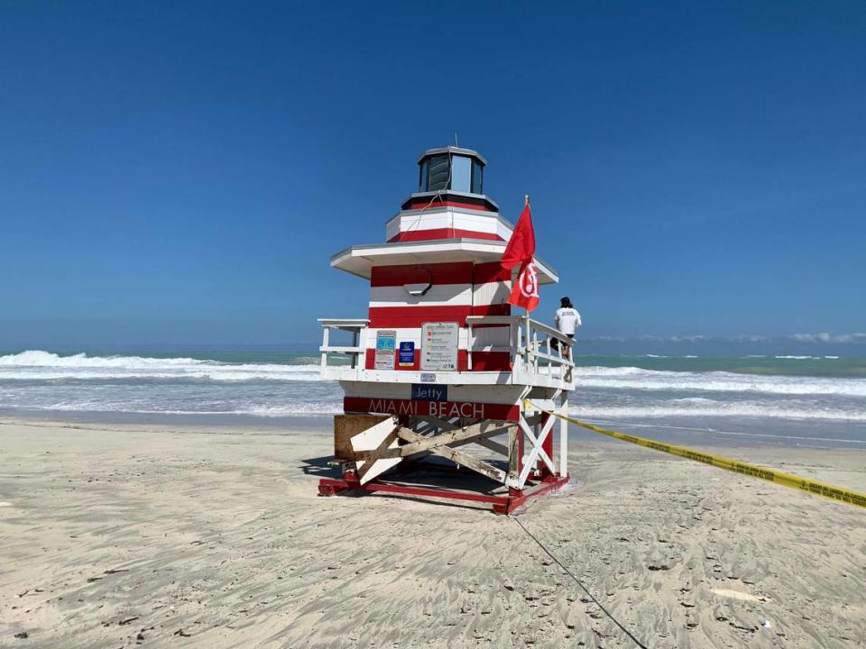 Lifeguards watch over the beach near South Pointe Park on Miami Beach on Friday afternoon, Sept. 30, 2022, during king tides and a high surf warning.