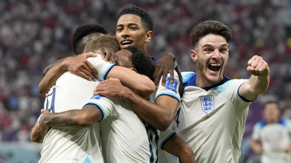 England&#39;s Raheem Sterling celebrates with teammates after scoring his side&#39;s third goal during the World Cup group B soccer match between England and Iran at the Khalifa International Stadium in Doha, Qatar, Monday, Nov. 21, 2022. (AP Photo/Frank Augstein)