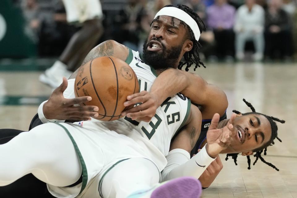 Detroit Pistons' Jaden Ivey and Detroit Pistons' Jaden Ivey go after a loose ball during the first half of an NBA basketball game Wednesday, Nov. 2, 2022, in Milwaukee. (AP Photo/Morry Gash)