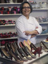 In this Feb. 7, 2013 photo, master chocolatier Andrea Pedraza shows off her chocolate shoes and other treats at her shop in the Oak Cliff section of Dallas. Florists and chocolate makers are working around the clock for the busy season - Valentine's Day. Pedraza's most well known creations are chocolate pumps done in the style of Christian Louboutin shoes. (AP Photo/LM Otero)