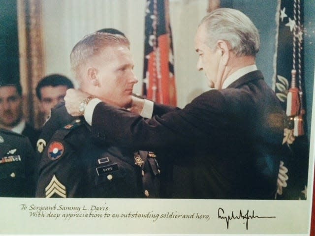 Sammy Lee Davis is awarded the Congressional Medal of Honor by President Lyndon Johnson.