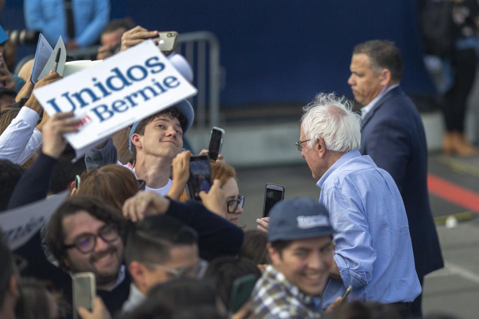 Democratic presidential candidate Sen. Bernie Sanders greets supports at his Get Out the Early Vote rally at Valley High School on Feb. 21, 2020 in Santa Ana, Calif.