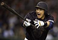 Japan's Nobuhiro Matsuda reacts after hitting his solo homer off U.S. Major League Baseball (MLB) All-Stars pitcher Tsuyoshi Wada of the Chicago Cubs during the eighth inning of an exhibition baseball game in Tokyo November 14, 2014. REUTERS/Toru Hanai (JAPAN - Tags: SPORT BASEBALL)