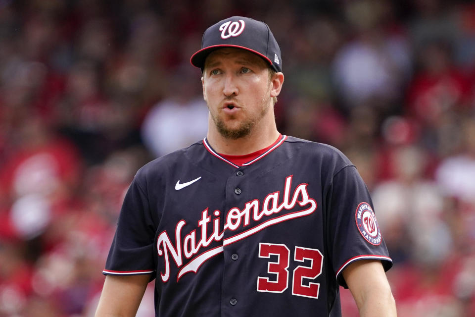 Washington Nationals starting pitcher Erick Fedde (32) reacts after walking Cincinnati Reds' Tyler Stephenson to load the bases during the first inning of a baseball game Saturday, June 4, 2022, in Cincinnati. (AP Photo/Jeff Dean)