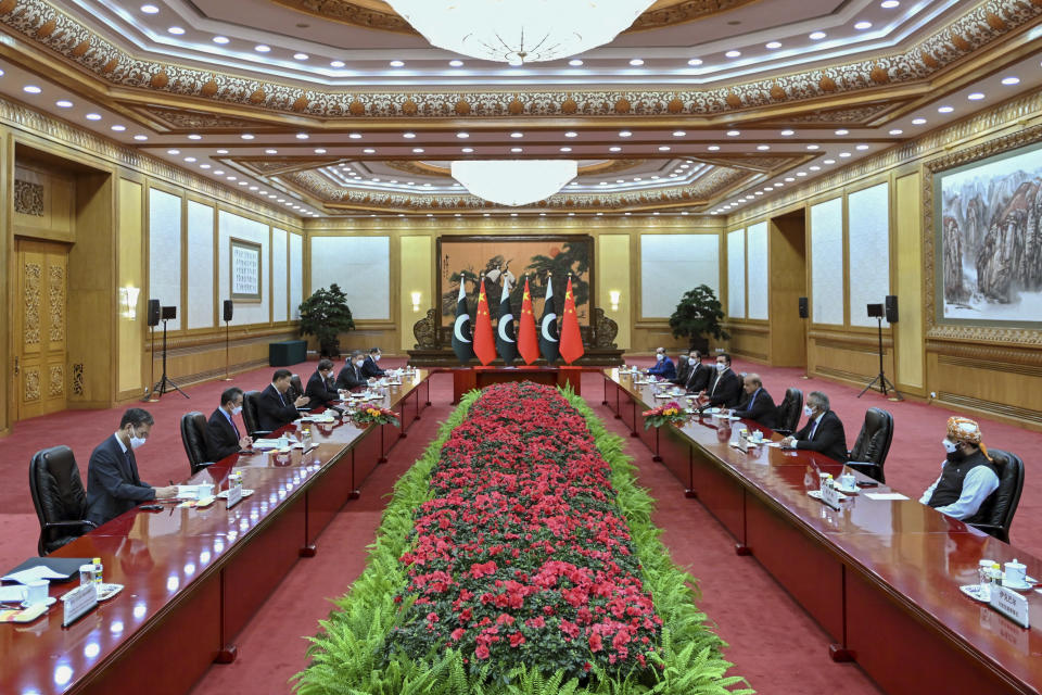 In this photo released by Xinhua News Agency, Chinese President Xi Jinping, third from left, speaks during a bilateral meeting with Pakistani Prime Minister Shahbaz Sharif, third from right, at the Great Hall of the People in Beijing, Wednesday, Nov. 2, 2022. Xi on Wednesday affirmed his country's commitment to invest in Pakistan despite obstacles created in recent years by security concerns and the global economic slowdown. (Xie Huanchi/Xinhua via AP)