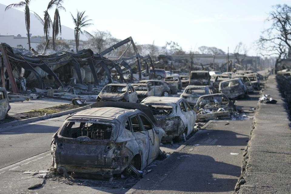 Burnt out cars line the sea wall after the wildfire on Friday, Aug. 11, 2023, in Lahaina, Hawaii. Hawaii emergency management records show no indication that warning sirens sounded before people ran for their lives from wildfires on Maui that wiped out a historic town. | Rick Bowmer, Associated Press