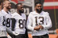 Cleveland Browns wide receiver Jarvis Landry (80) and Cleveland Browns wide receiver Odell Beckham Jr. (13) watch during an NFL football practice, Saturday, July 31, 2021, in Berea, Ohio. (AP Photo/Tony Dejak)