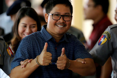 FILE PHOTO: Detained Reuters journalist Wa Lone arrives at Insein court in Yangon, Myanmar August 6, 2018. REUTERS/Ann Wang/File Photo