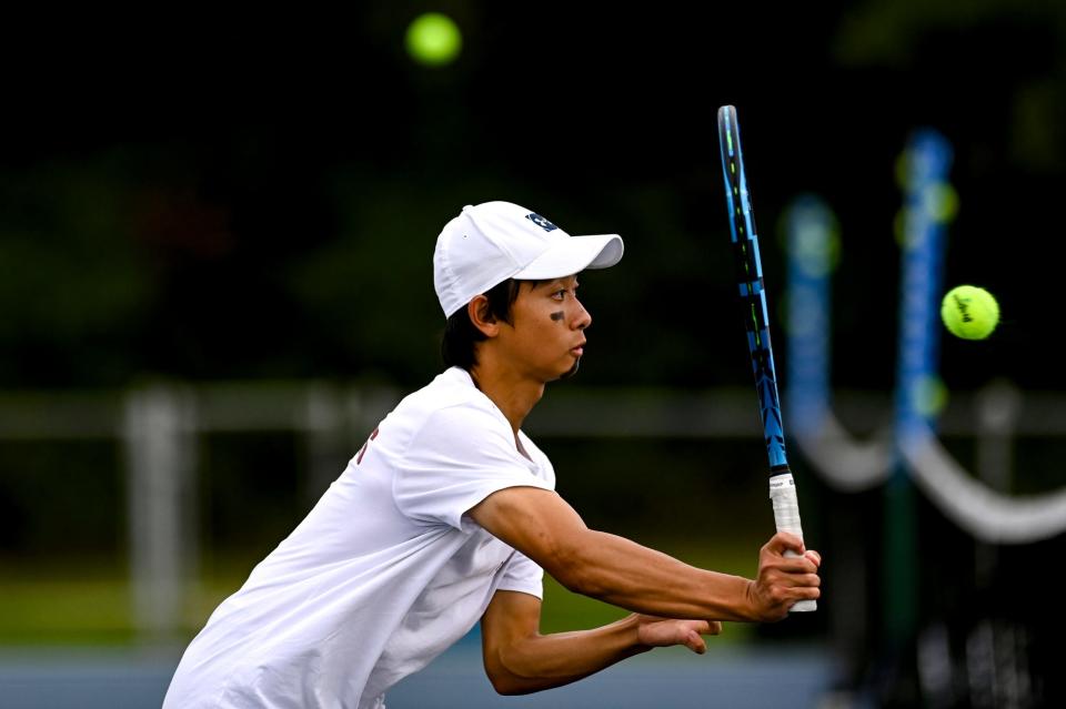 Alex Zhang, shown during a match last month, was part of the champion No. 1 doubles tandem for Okemos in Wednesday's Division 1 regional in Kalamazoo. He helped the Wolves in a regional title.
