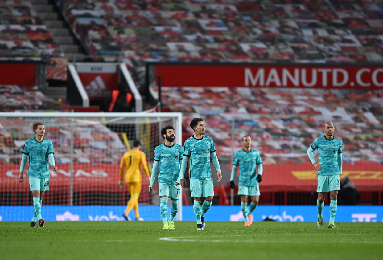 Liverpool players look dejected after Manchester United's Bruno Fernandes scored the winning goal in their FA Cup fourth-round tie.