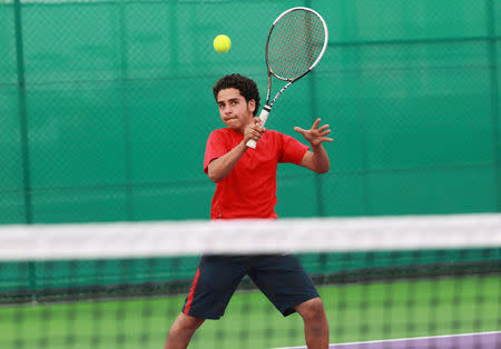 Alhassan Ishaq from Sanaa, 13, takes part in a training session at Khalifa International Tennis and Squash Complex in Doha, Qatar, March 2, 2017. Picture taken March 2, 2017. REUTERS/Naseem Zeitoon