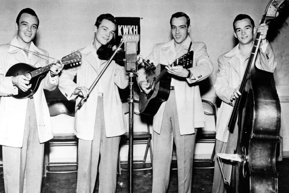 SHREVEPORT, LA - CIRCA 1950: String band The Williams Brothers perform on radio station KWKH-AM which was famous for hosting the "Louisiana Hayride" radio program in circa 1950 in Shreveport, Louisianna. (Photo by Michael Ochs Archives/Getty Images)