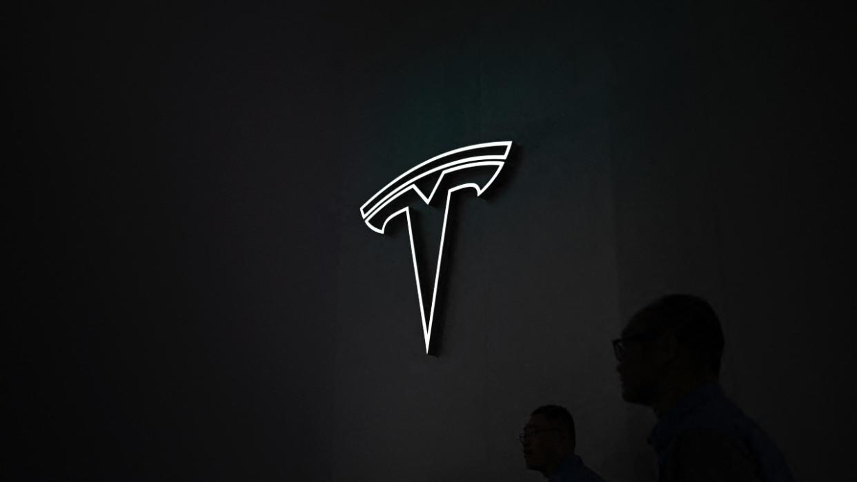 A logo of Tesla