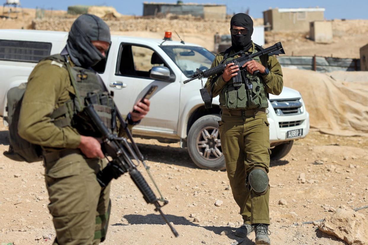 Israeli soldiers patrol the Palestinian Bedouin village of Tala (Thala) in the occupied West Bank on Oct. 26, 2023, after residents were attacked by Israeli settlers the same day. <a href="https://www.gettyimages.com/detail/news-photo/israeli-soldiers-patrol-in-the-palestinian-bedouin-village-news-photo/1783231360?adppopup=true" rel="nofollow noopener" target="_blank" data-ylk="slk:HOMAS COEX/AFP via Getty Images;elm:context_link;itc:0;sec:content-canvas" class="link ">HOMAS COEX/AFP via Getty Images</a>