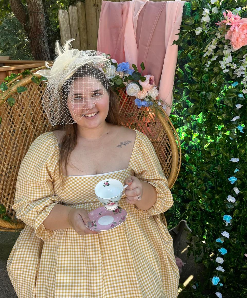 Sydni Stinnett is lovely in yellow at her going away English Tea Party held in her backyard in Karns, Sept. 16, 2023.