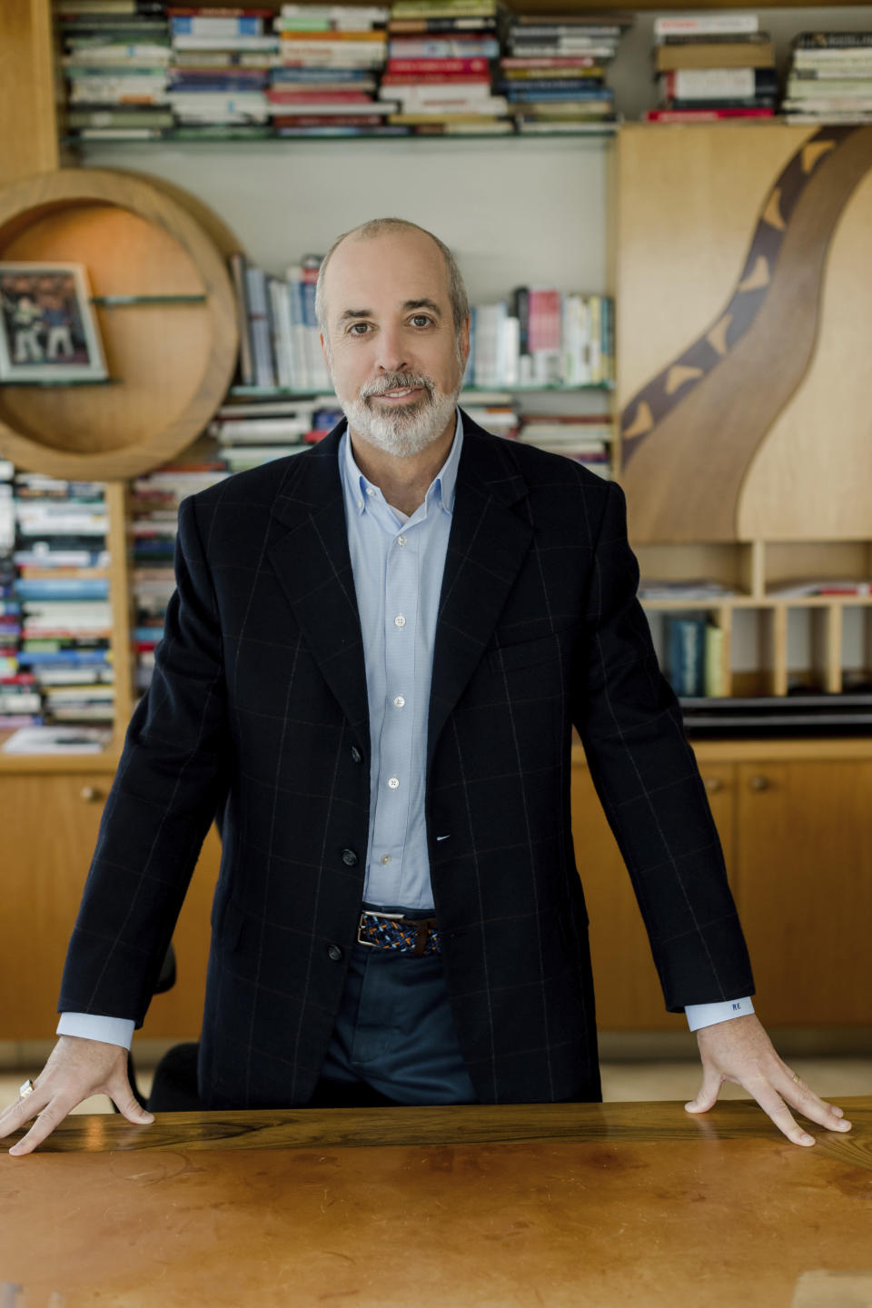 In this March 2020 photo provided by Edelman Financial Engines, Ric Edelman poses in his office in Fairfax, Virginia. (Liz Banfield/Edelman Financial Engines via AP)