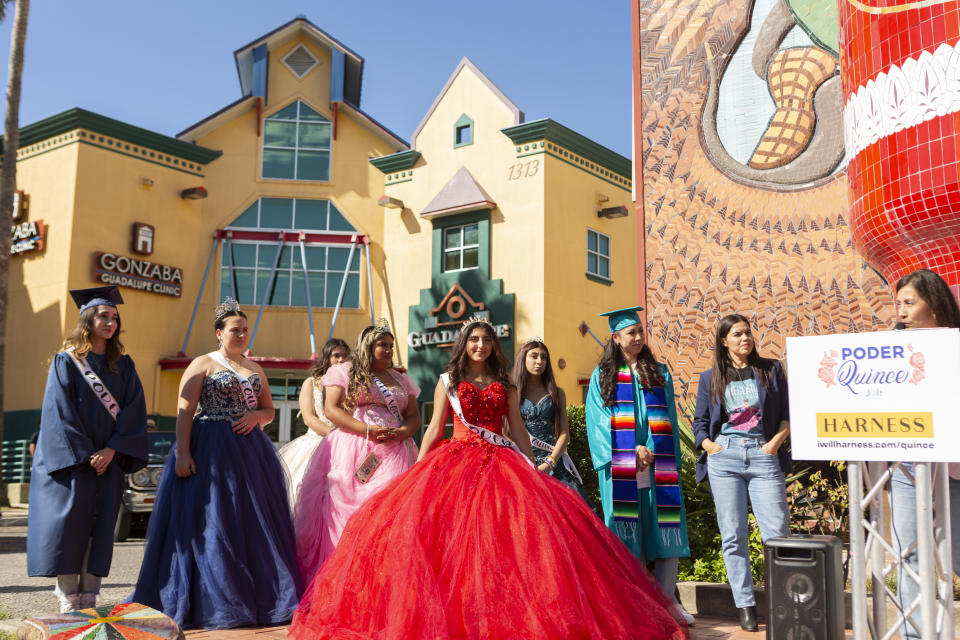 Young women dressed in their quince dresses for the event.  (Courtesy Quince to the Polls)