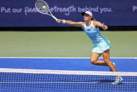 Iga Swiatek, of Poland, returns a shot to Madison Keys, of the United States, during the Western & Southern Open tennis tournament, Thursday, Aug. 18, 2022, in Mason, Ohio. (AP Photo/Aaron Doster)