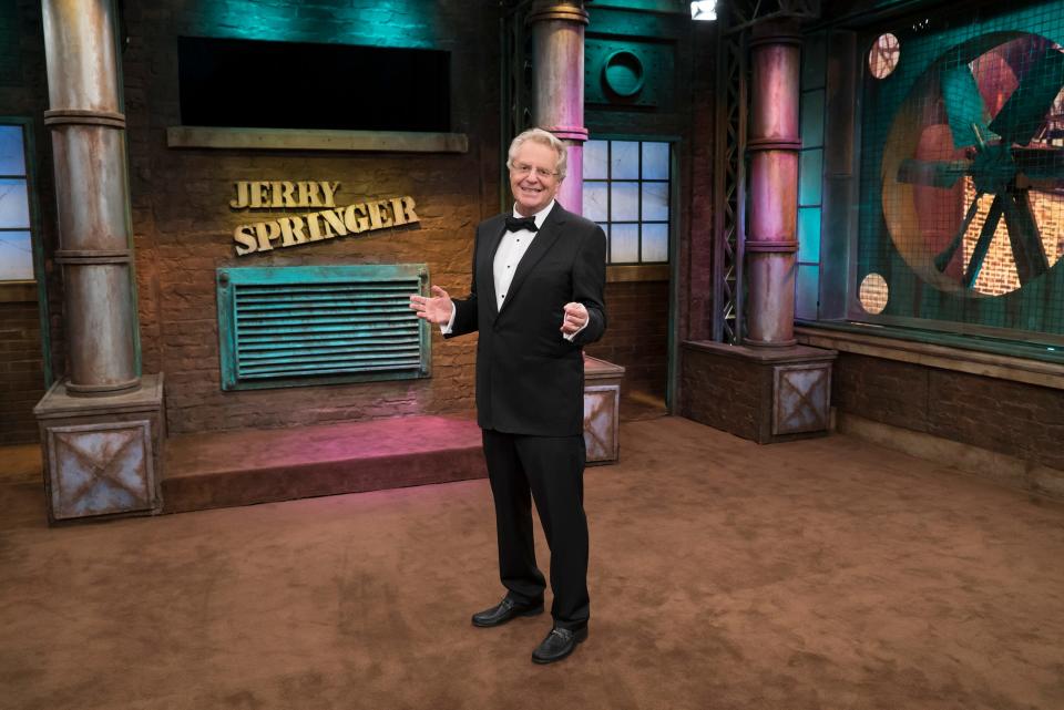 Jerry Springer in a tuxedo on the set of his show "Jerry Springer"