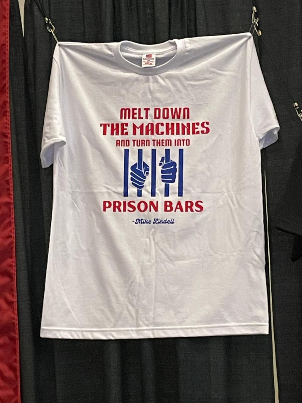 A T-shirt sold at the at the Mike Lindell Election Crime Bureau Summit on Aug. 16, 2023 in Springfield, MO bears a slogan repeated by Lindell during the event.