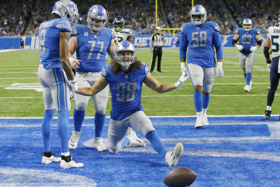 Detroit Lions tight end T.J. Hockenson (88) reacts after his successful two-point conversion catch during the second half of an NFL football game against the Seattle Seahawks, Sunday, Oct. 2, 2022, in Detroit. (AP Photo/Duane Burleson)