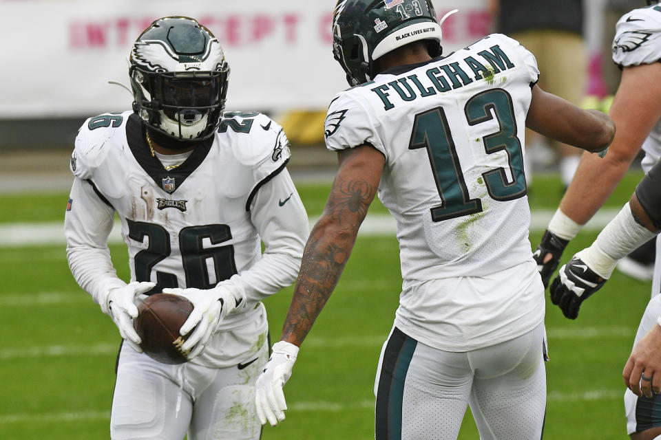 Philadelphia Eagles running back Miles Sanders (26) celebrates his touchdown with Travis Fulgham(13) during the first half of an NFL football game against the Pittsburgh Steelers in Pittsburgh, Sunday, Oct. 11, 2020. (AP Photo/Don Wright)