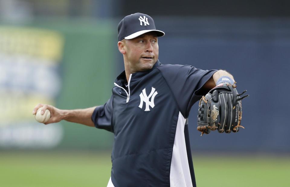 New York Yankees shortstop Derek Jeter warms up before an exhibition baseball game against the Pittsburgh Pirates Thursday, Feb. 27, 2014, in Tampa, Fla. (AP Photo/Charlie Neibergall)