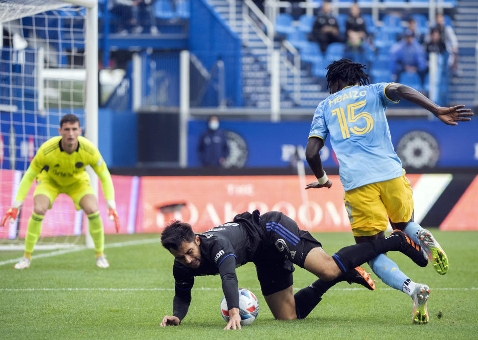 CF Montreal's Mathieu Choiniere (29) collides with Philadelphia Union's Olivier Mbaizo (15) during the first half of an MLS soccer game, Saturday, Oct. 16, 2021, in Montreal. (Graham Hughes/The Canadian Press via AP)