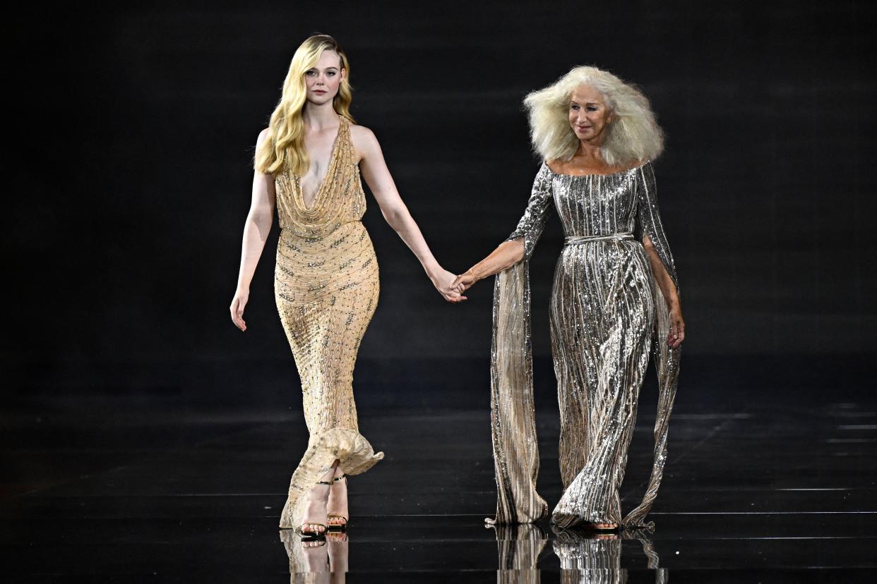 Helen Mirren appeared on the runway with Elle Fanning. (Getty Images)