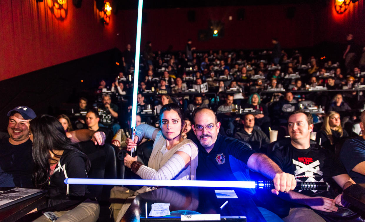 A costumed, lightsaber-wielding audience screening 