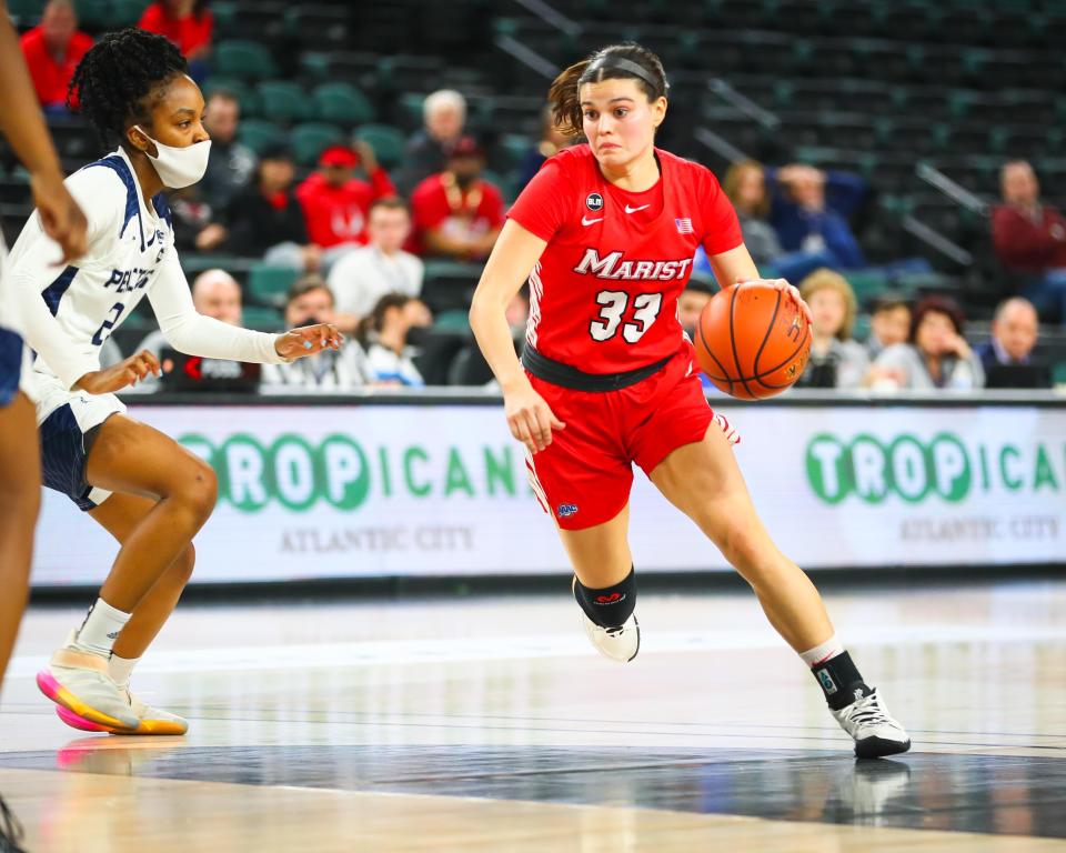 Kendall Krick of Marist (33) drives toward the basket in a Metro Atlantic first-round playoff game with Saint Peter's at Boardwalk Hall in Atlantic City, N.J., on Tuesday. Marist fell 49-29. METRO ATLANTIC ATHLETIC CONFERENCE