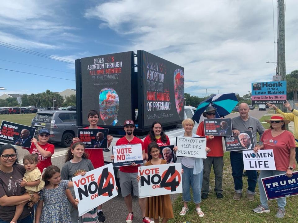 Members of Students for Life Action protest Joe Biden’s campaign stop in Florida on Tuesday. The group is opposed to abortion and supports the state’s six-week ban. (Students for Life Action)