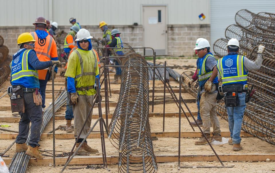 Construction workers work on steel rebar in March as the city of Pflugerville works to expand its water treatment plant to keep up with its growing population. This expansion will help meet projected water demand through 2040.