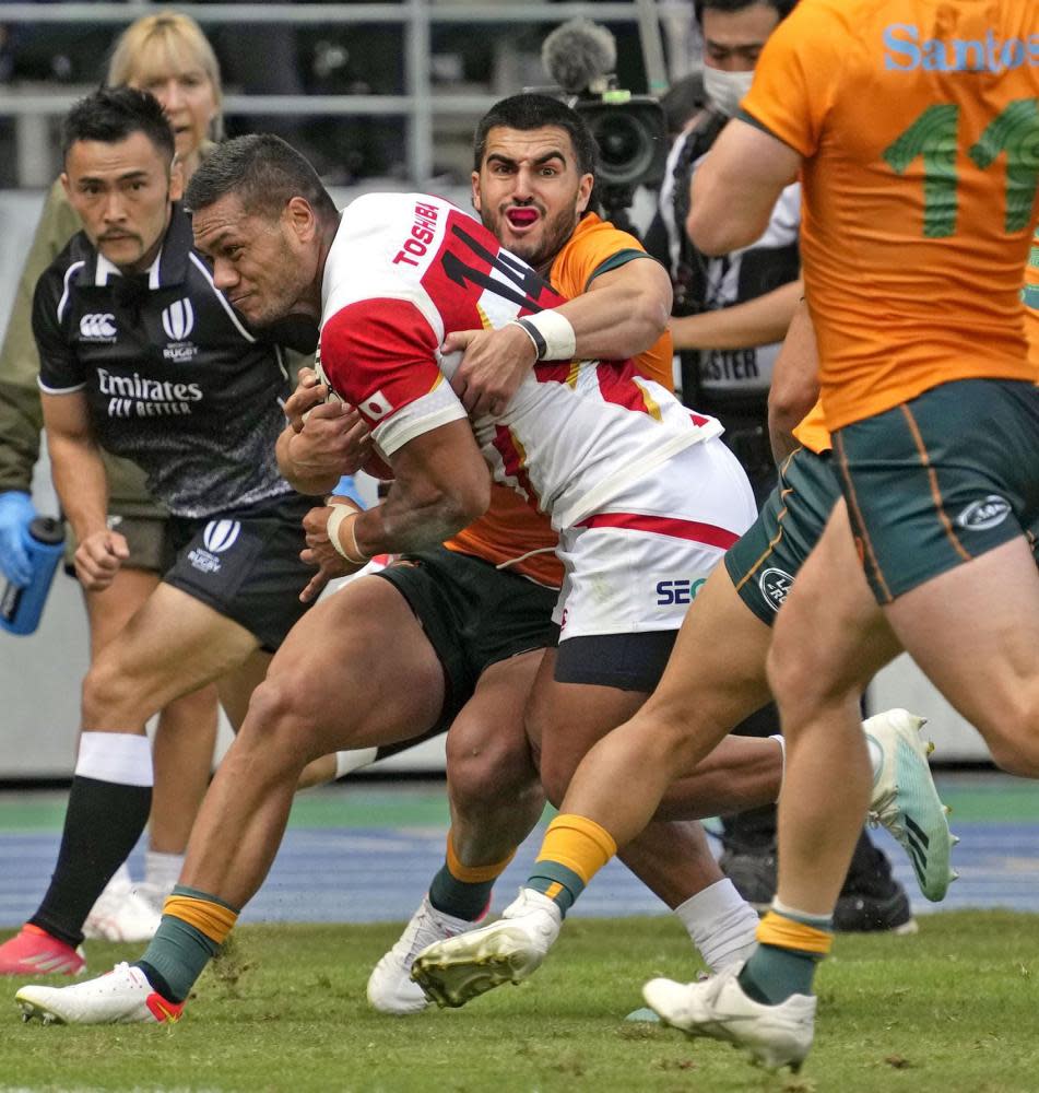 Japan’s Lomano Lemeki en route to scoring a try.