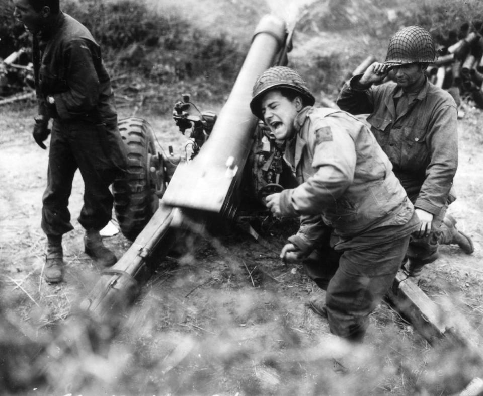 American howitzers shell German forces retreating near Carentan in 1944 (Getty Images)