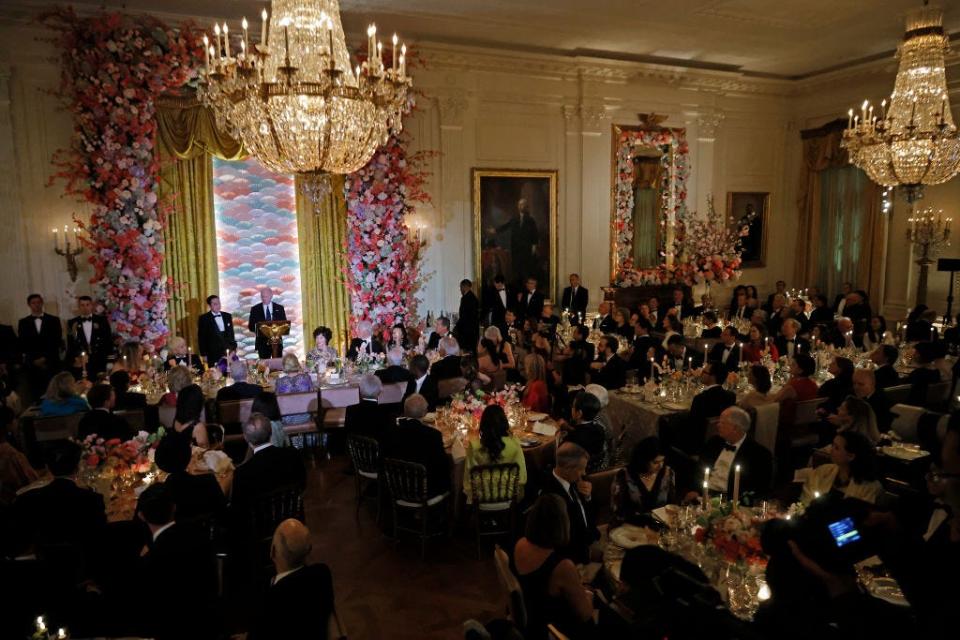 President Joe Biden and Japanese Prime Minister Fumio Kishida toast each other during a state dinner in the East Room of the White House